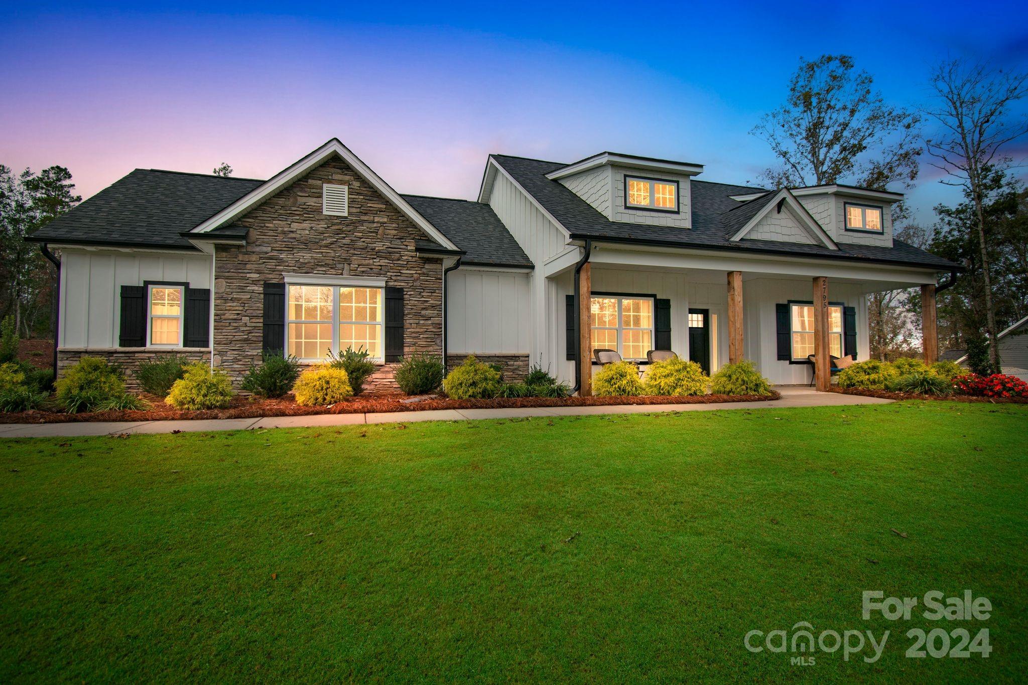 2795 Craig Farm Road Lancaster, SC 29720 - Photo 1 of 44 a front view of a house with garden