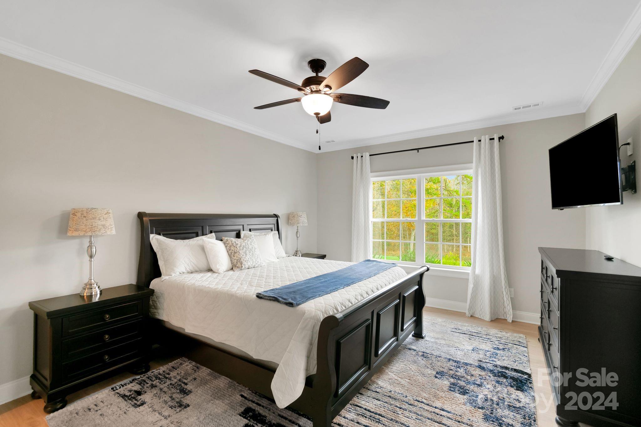 2795 Craig Farm Road Lancaster, SC 29720 - Photo 17 of 44 a bedroom with a bed and a flat screen tv