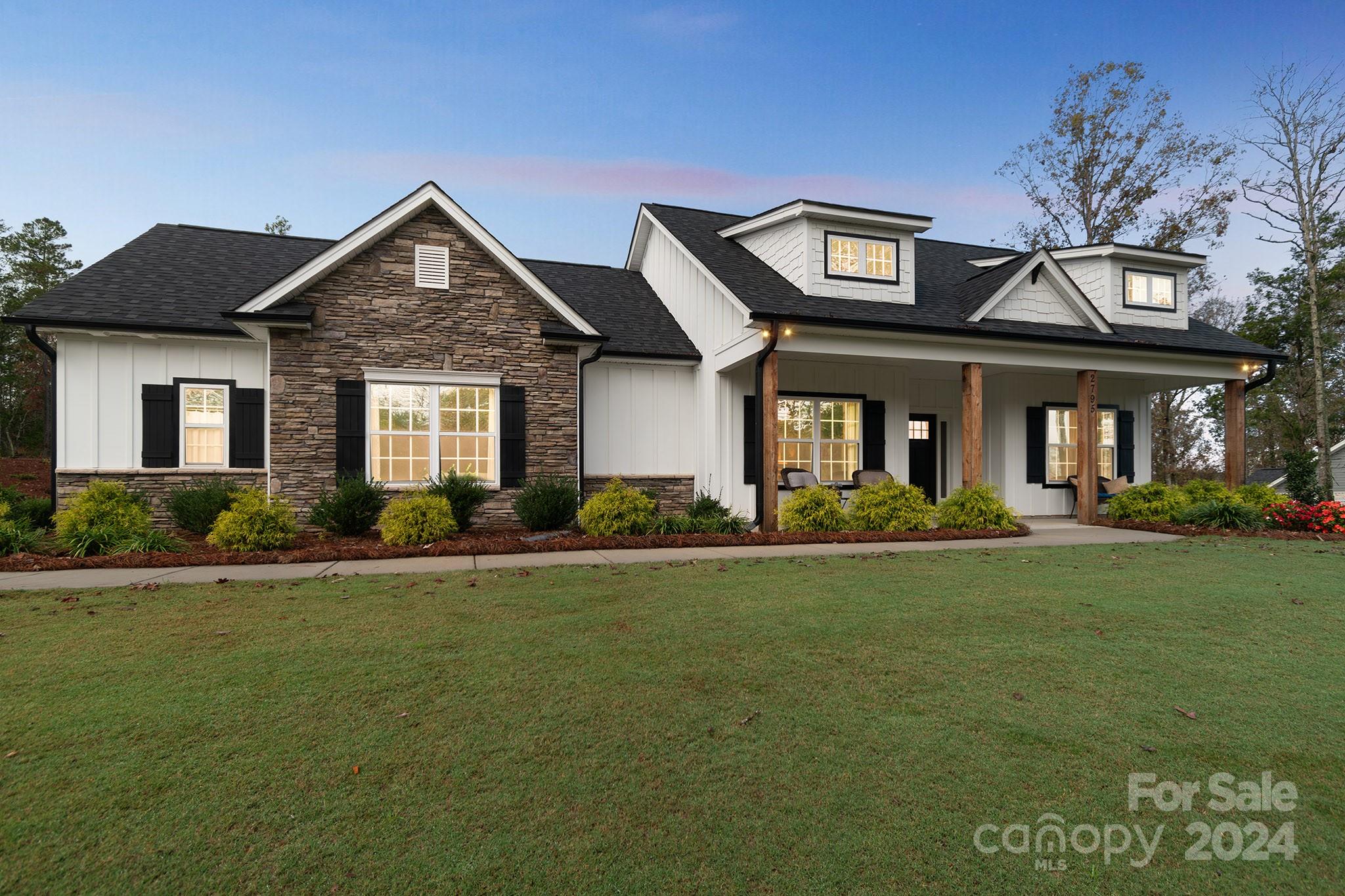 2795 Craig Farm Road Lancaster, SC 29720 - Photo 23 of 44 a front view of a house with a garden