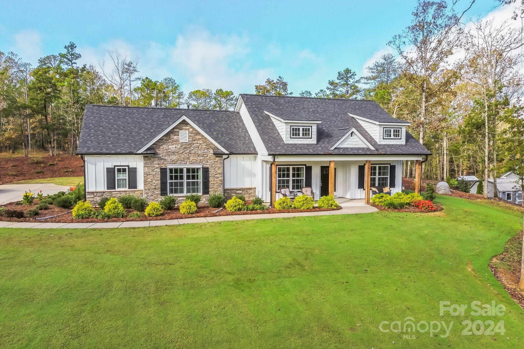 2795 Craig Farm Road Lancaster, SC 29720 - Photo 27 of 44 a front view of a house with swimming pool having outdoor seating