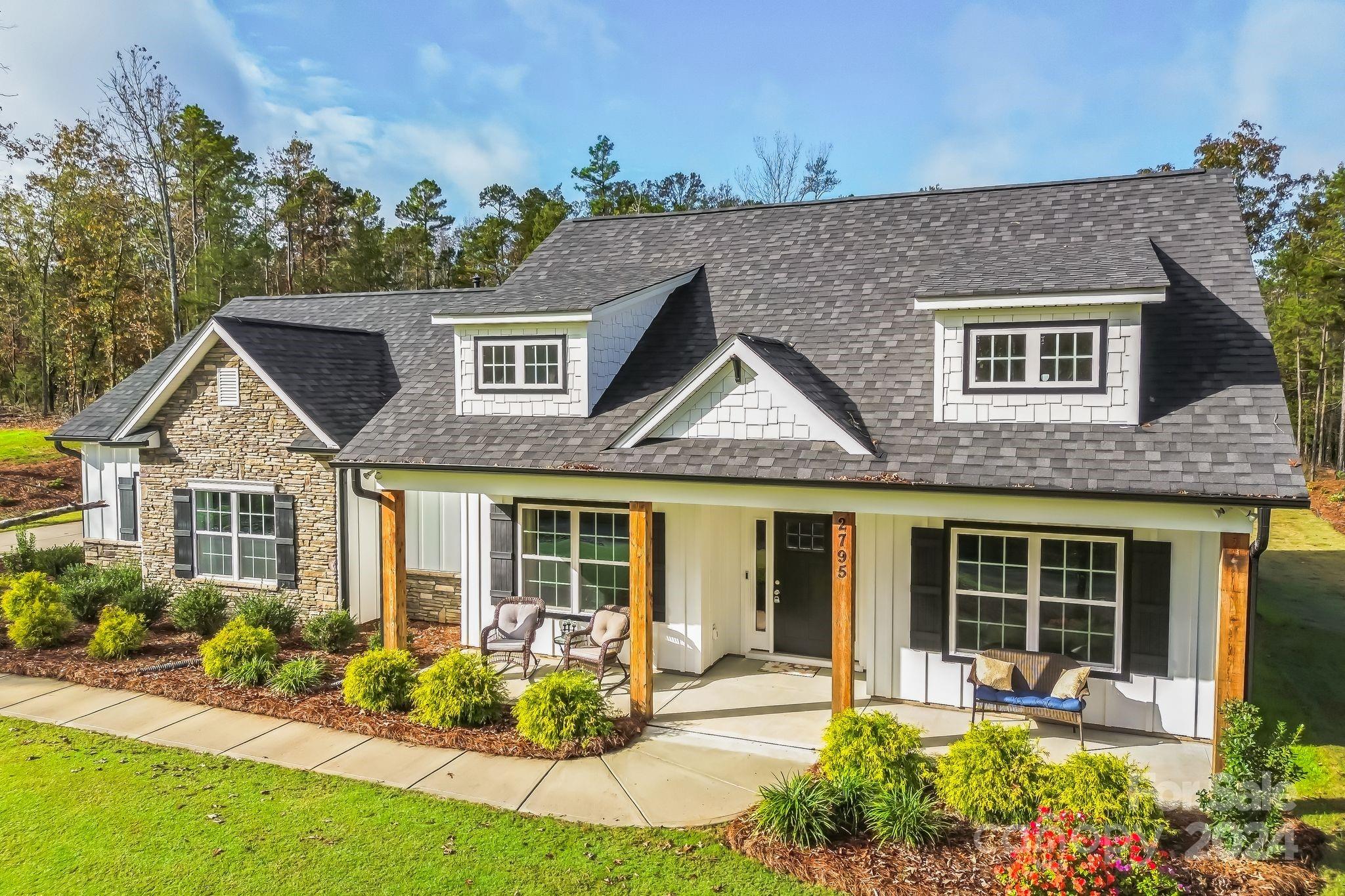 2795 Craig Farm Road Lancaster, SC 29720 - Photo 29 of 44 a front view of a house with garden and porch