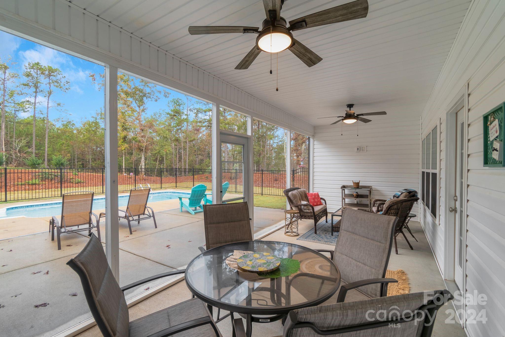 2795 Craig Farm Road Lancaster, SC 29720 - Photo 33 of 44 a living room with furniture and a floor to ceiling window