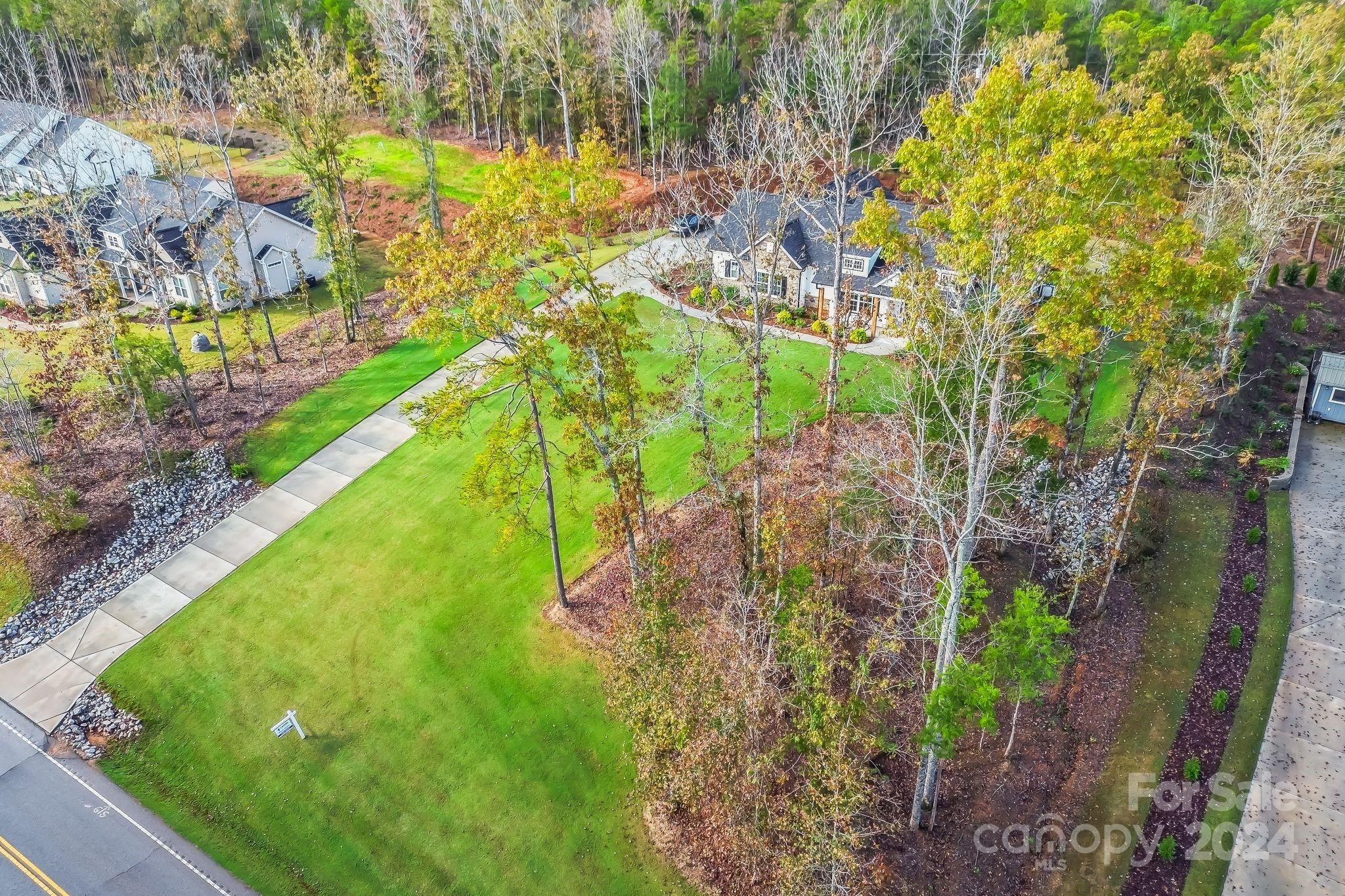 2795 Craig Farm Road Lancaster, SC 29720 - Photo 42 of 44 a view of a yard with plants and large trees