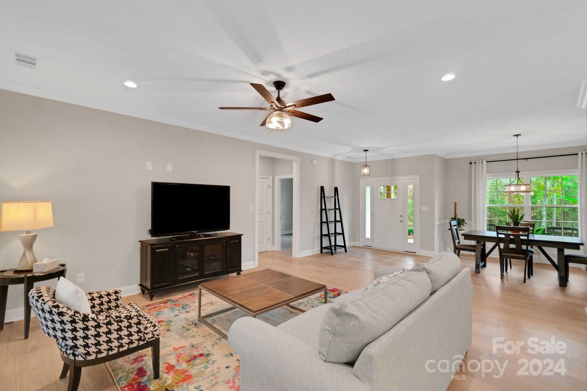 2795 Craig Farm Road Lancaster, SC 29720 - Photo 7 of 44 a living room with furniture a window and a flat screen tv