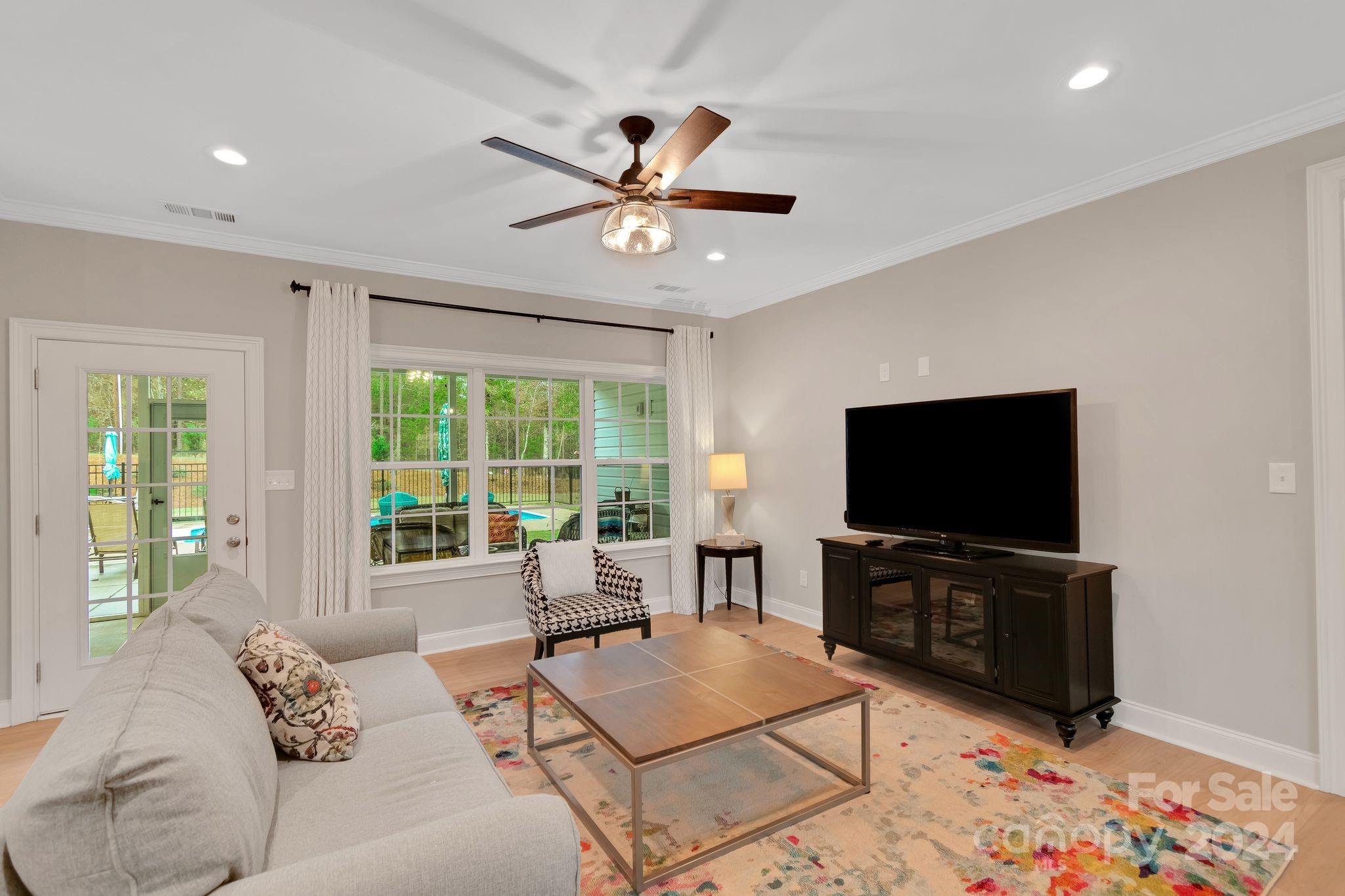 2795 Craig Farm Road Lancaster, SC 29720 - Photo 8 of 44 a living room with furniture and a flat screen tv