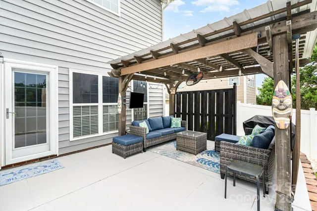 a outdoor space with patio the couches and a dining table with the garden view