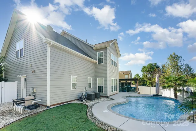 a view of a backyard with sitting area
