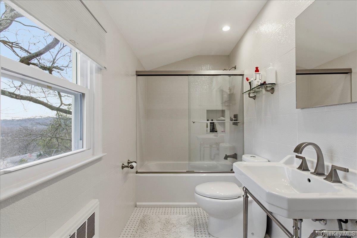 169 Canterbury Road White Plains, NY 10607 - Photo 12 of 27 a bathroom with a sink toilet and shower