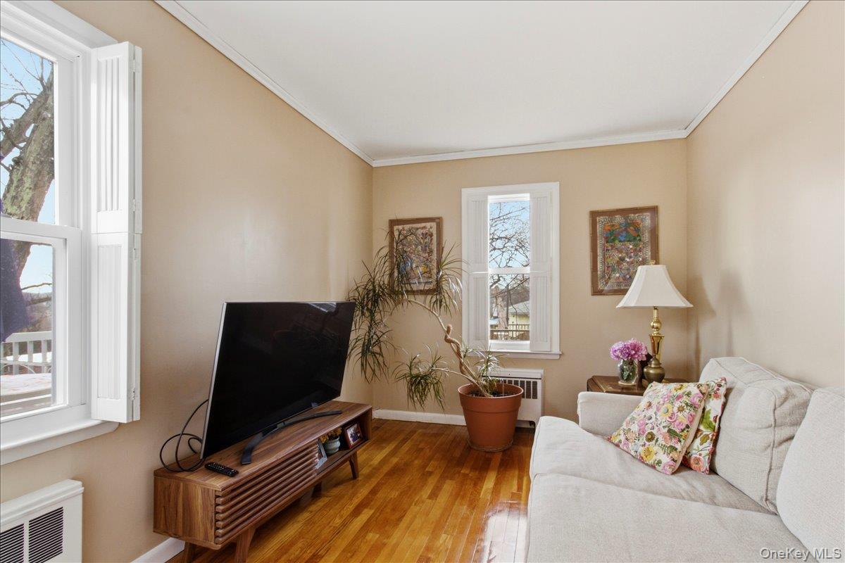 169 Canterbury Road White Plains, NY 10607 - Photo 15 of 27 a living room with furniture and a flat screen tv