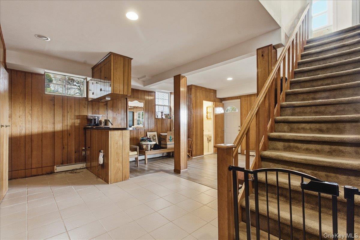 169 Canterbury Road White Plains, NY 10607 - Photo 16 of 27 a view of hallway with furniture and a refrigerator