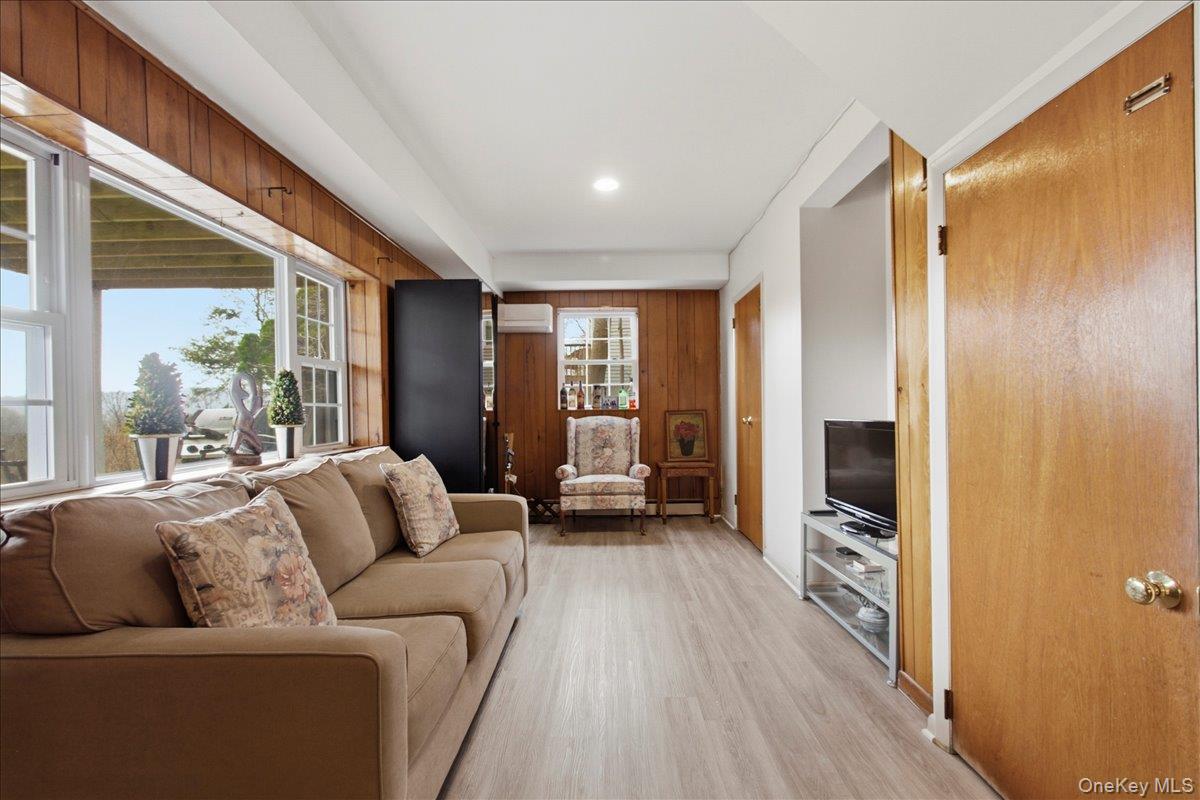 169 Canterbury Road White Plains, NY 10607 - Photo 17 of 27 a living room with furniture and a flat screen tv