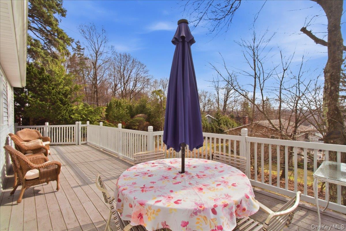 169 Canterbury Road White Plains, NY 10607 - Photo 19 of 27 a view of a wooden chairs and table in the patio