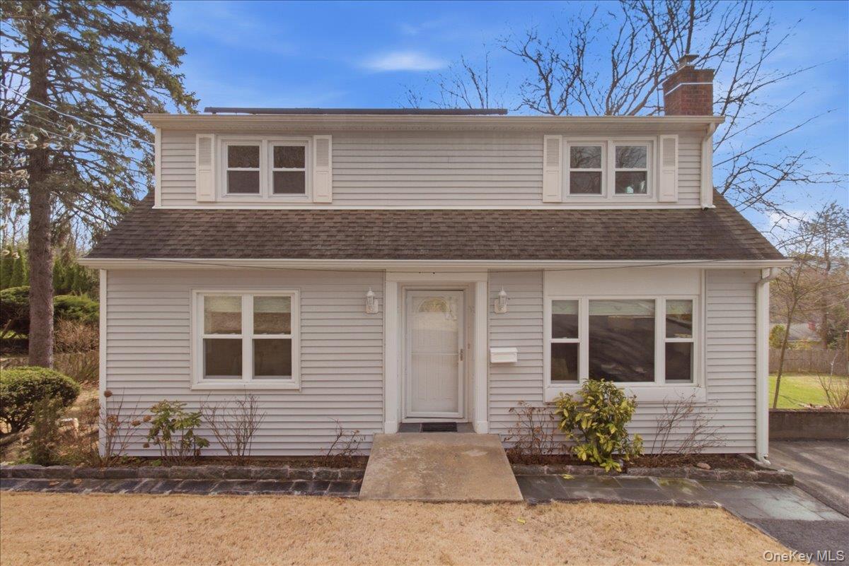169 Canterbury Road White Plains, NY 10607 - Photo 2 of 27 a front view of a house with a yard and outdoor seating