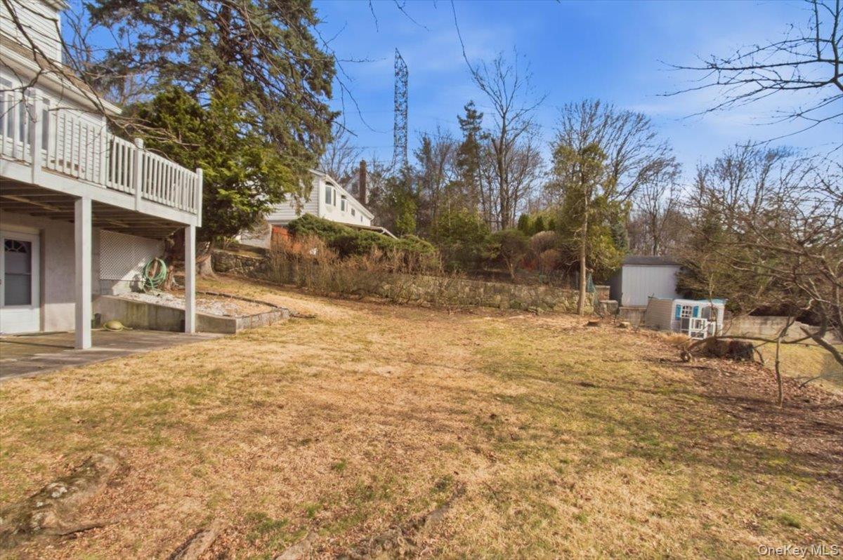 169 Canterbury Road White Plains, NY 10607 - Photo 23 of 27 a backyard of a house with table and chairs