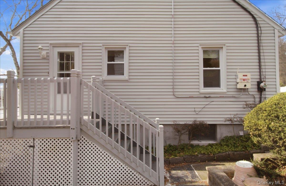 169 Canterbury Road White Plains, NY 10607 - Photo 24 of 27 a view of a house with a small deck