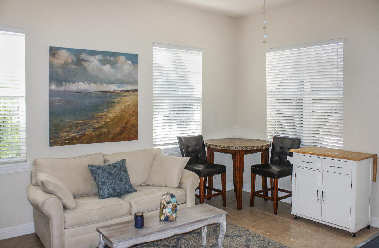 113 Inkberry Drive Jupiter, FL 33458 - Photo 4 of 4 a living room with furniture and windows