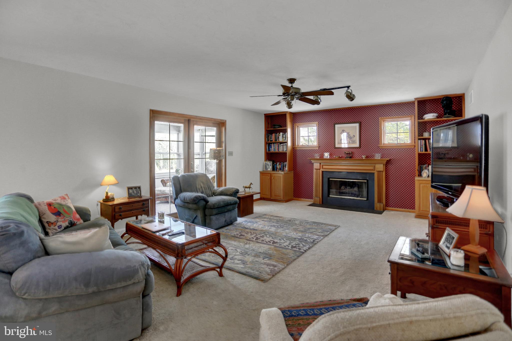 501 Knight Road Gettysburg, PA 17325 - Photo 11 of 37 a living room with furniture a flat screen tv and a fireplace