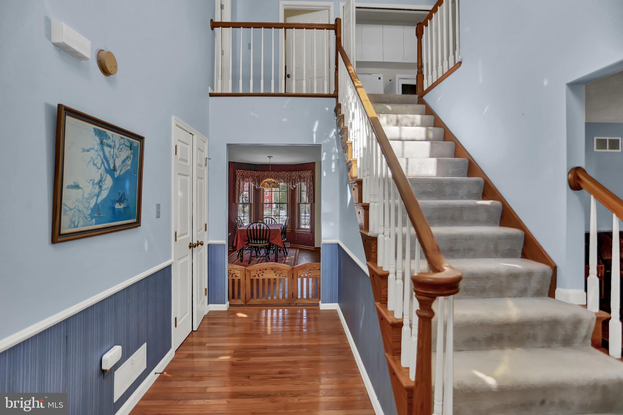 501 Knight Road Gettysburg, PA 17325 - Photo 4 of 37 a view of staircase with lots of frames on wall and a dining table