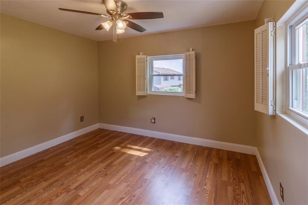 803 Cliff Mine Road Imperial, PA 15126 - Photo 12 of 24 a view of an empty room with wooden floor and a window
