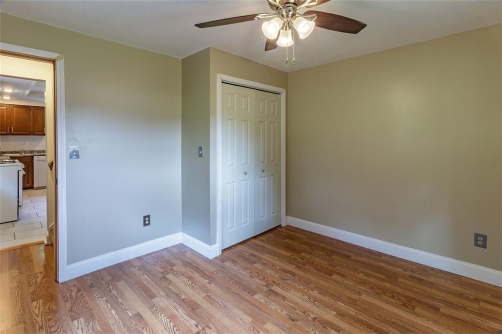 803 Cliff Mine Road Imperial, PA 15126 - Photo 13 of 24 an empty room with wooden floor closet and windows