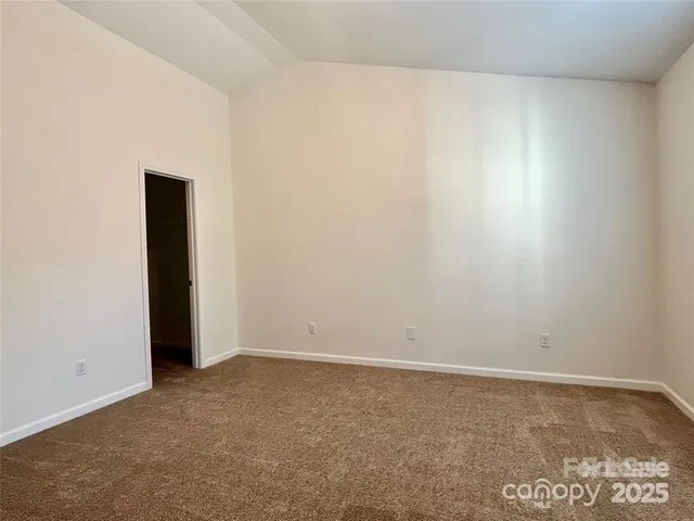 a bathroom with a sink vanity mirror and toilet