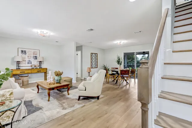 a living room with furniture and a table