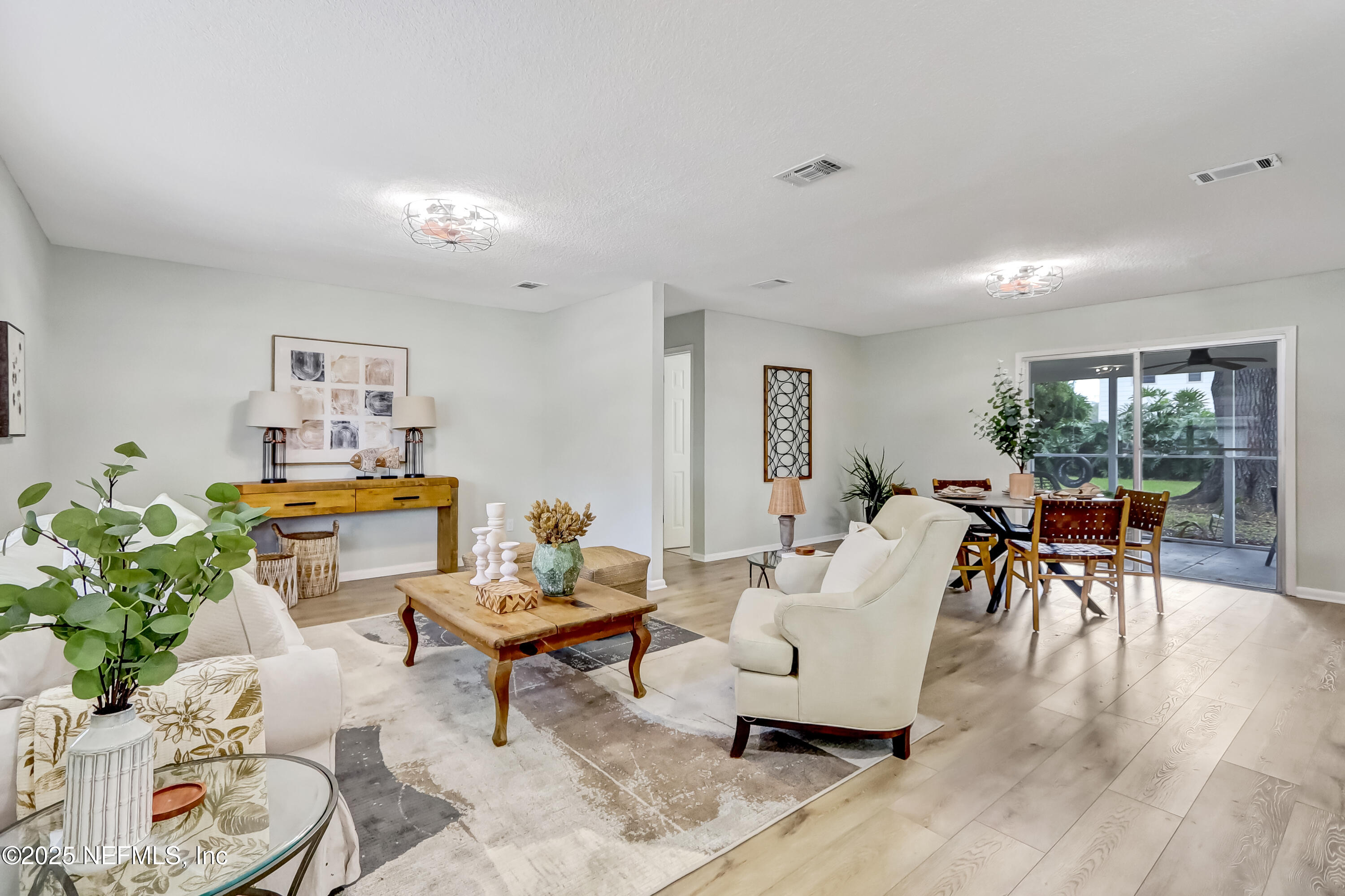 8837 Runnymeade Road Jacksonville, FL 32257 - Photo 12 of 55 a living room with furniture and a table