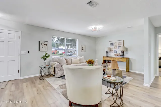 a living room with furniture and a window