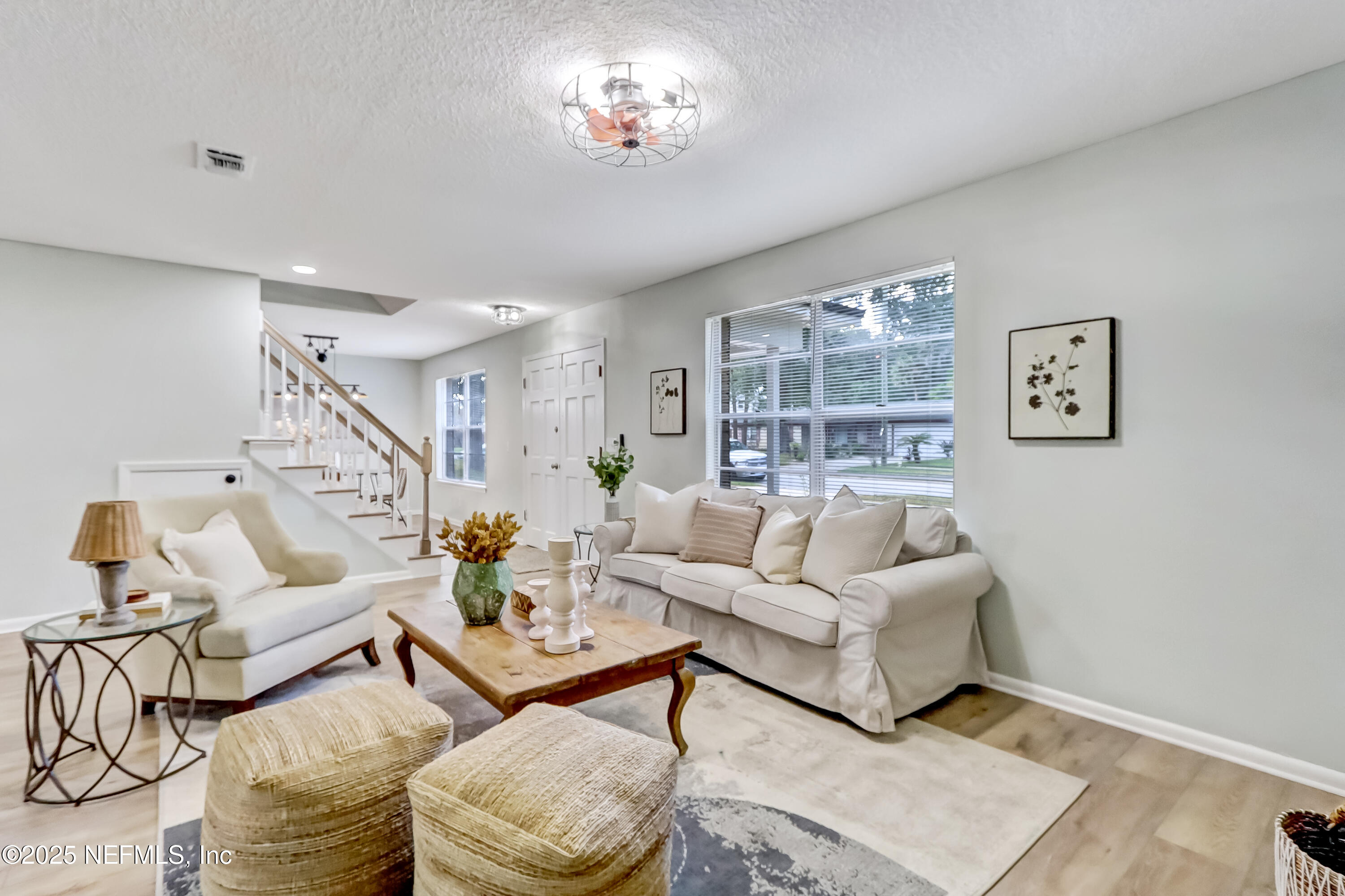 8837 Runnymeade Road Jacksonville, FL 32257 - Photo 14 of 55 a living room with furniture and a window
