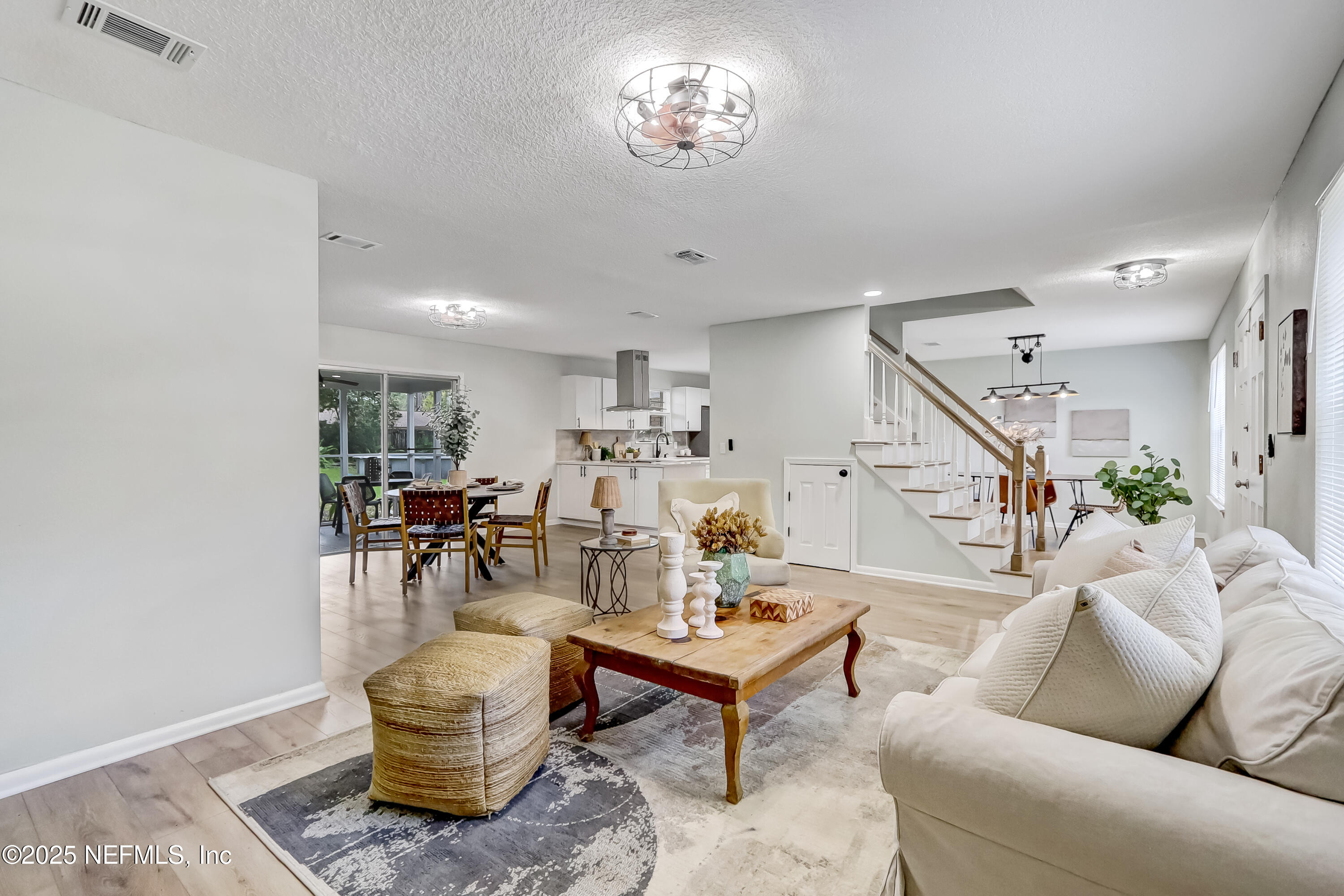 8837 Runnymeade Road Jacksonville, FL 32257 - Photo 15 of 55 a living room with furniture and wooden floor