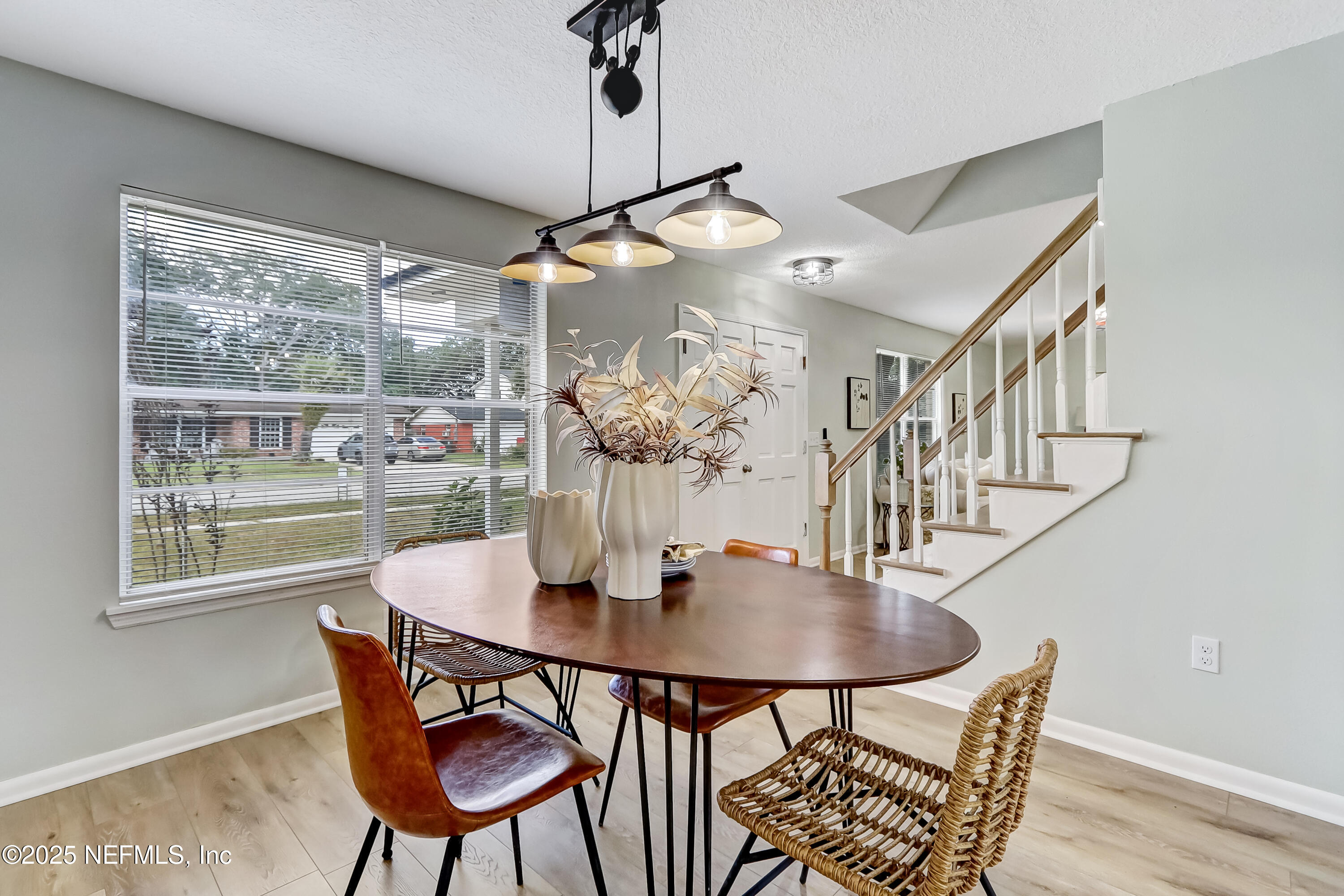 8837 Runnymeade Road Jacksonville, FL 32257 - Photo 16 of 55 a dining room with furniture and window