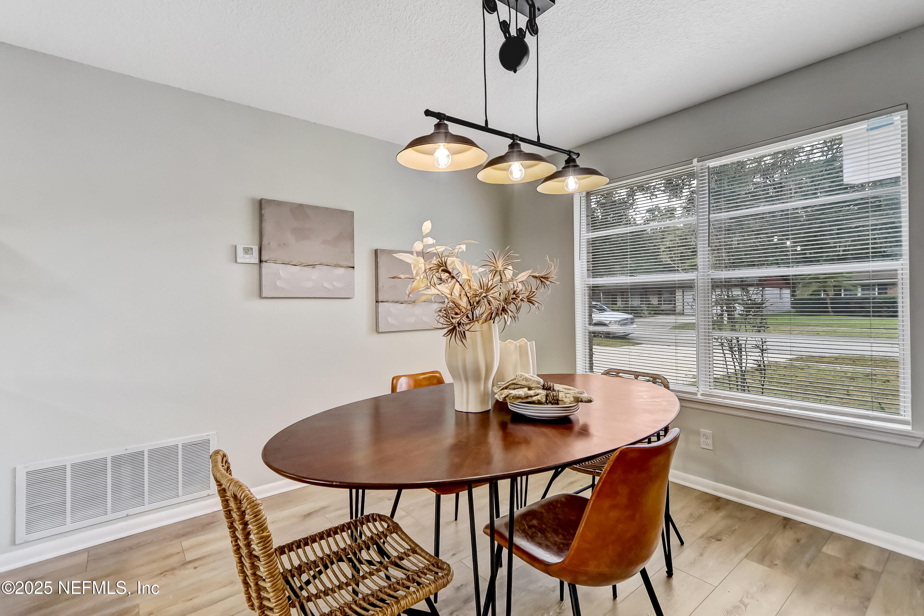8837 Runnymeade Road Jacksonville, FL 32257 - Photo 17 of 55 a dining room with furniture and window