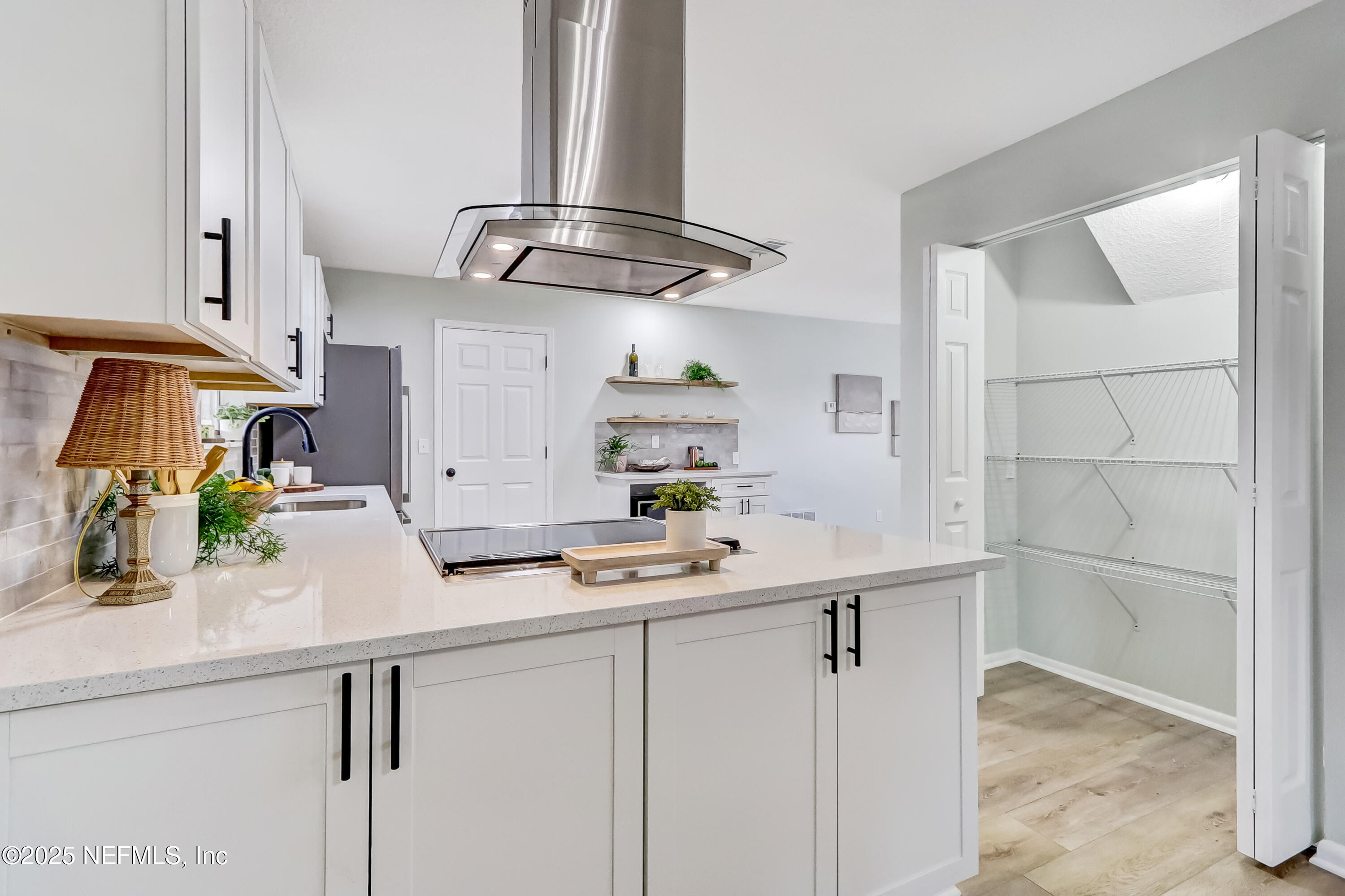 8837 Runnymeade Road Jacksonville, FL 32257 - Photo 25 of 55 a kitchen with stainless steel appliances a sink and cabinets