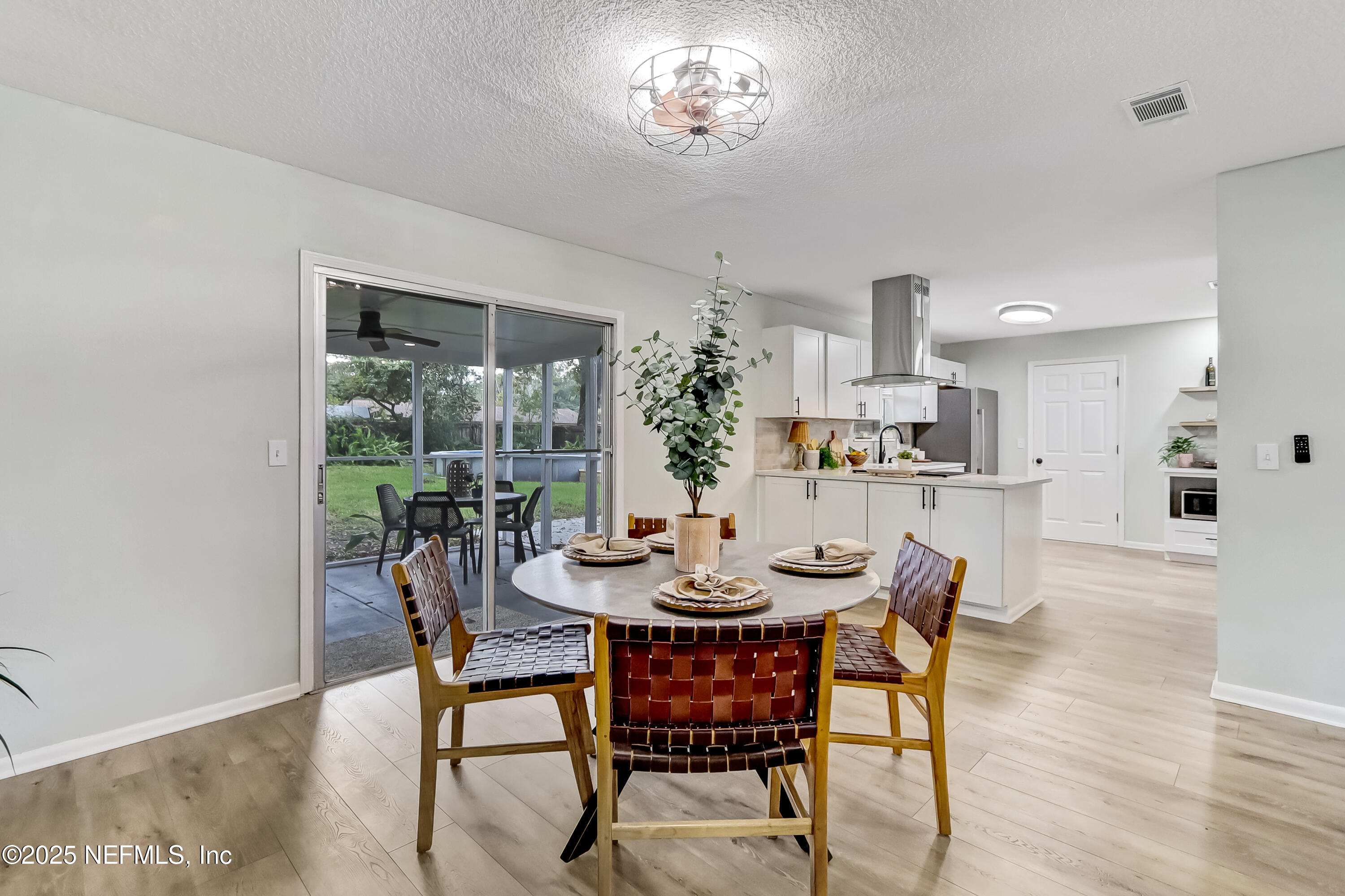 8837 Runnymeade Road Jacksonville, FL 32257 - Photo 28 of 55 a view of a dining room with furniture and wooden floor