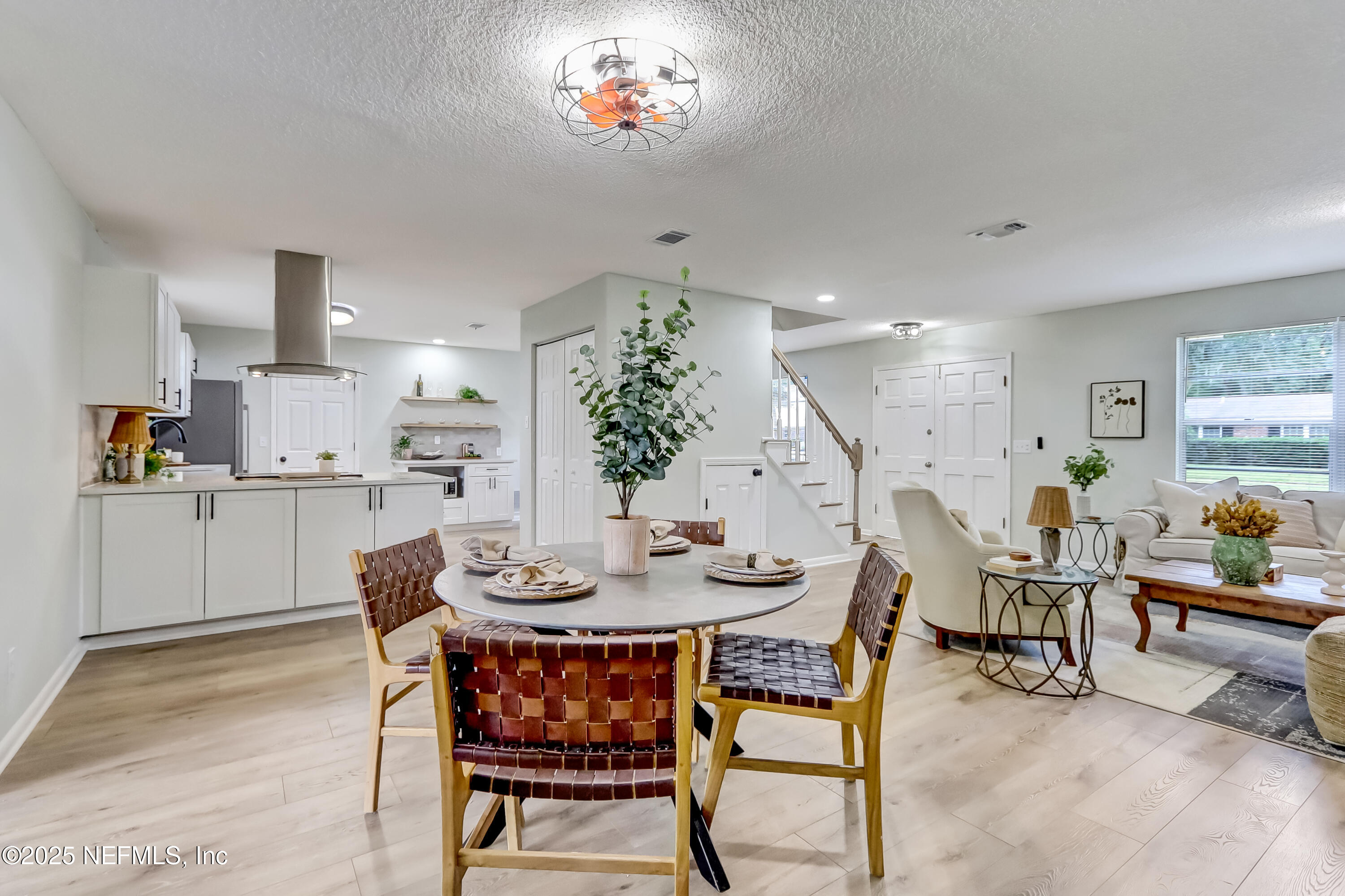 8837 Runnymeade Road Jacksonville, FL 32257 - Photo 29 of 55 a dining room with furniture and wooden floor