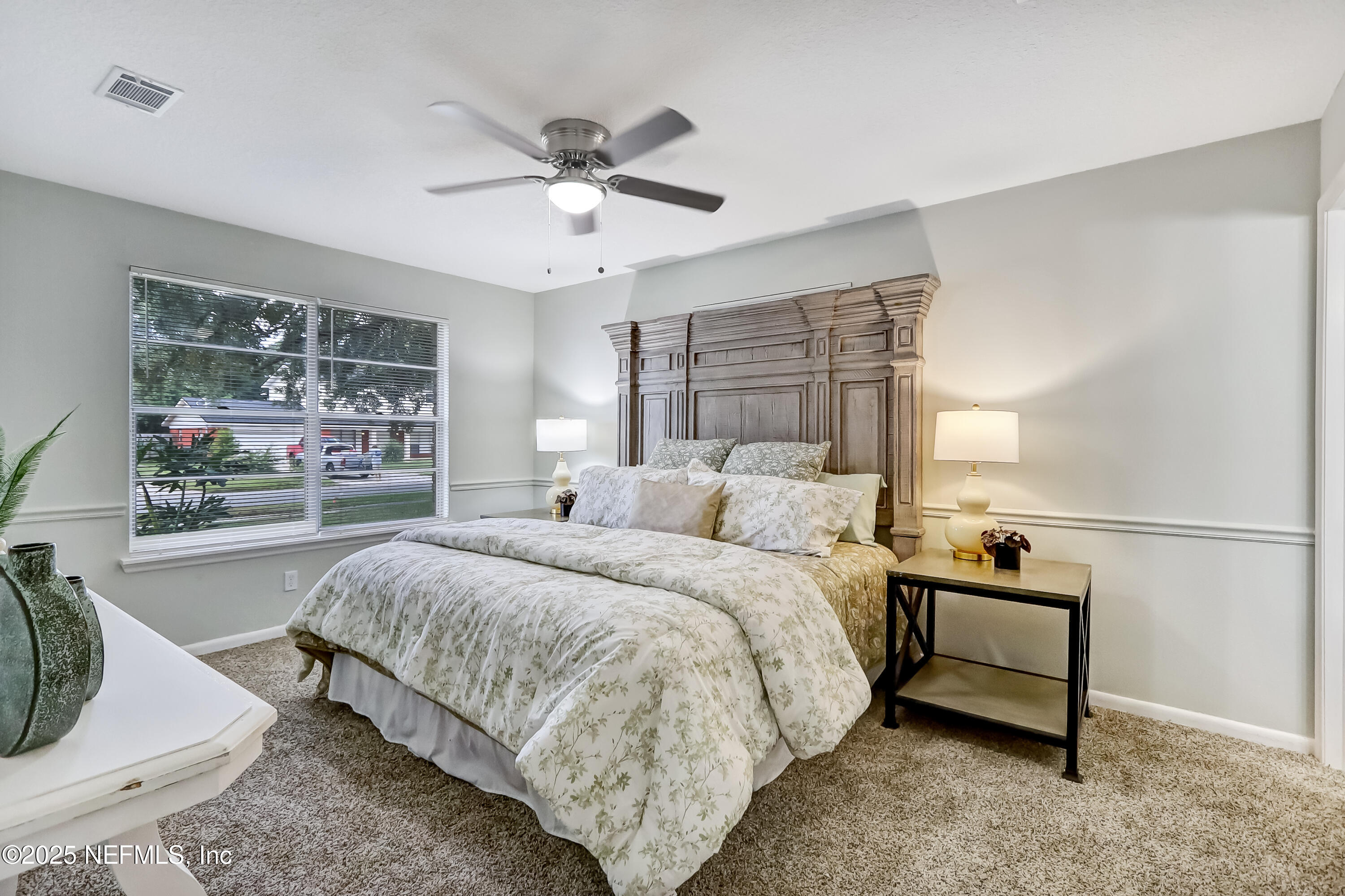 8837 Runnymeade Road Jacksonville, FL 32257 - Photo 31 of 55 a bedroom with a bed and window