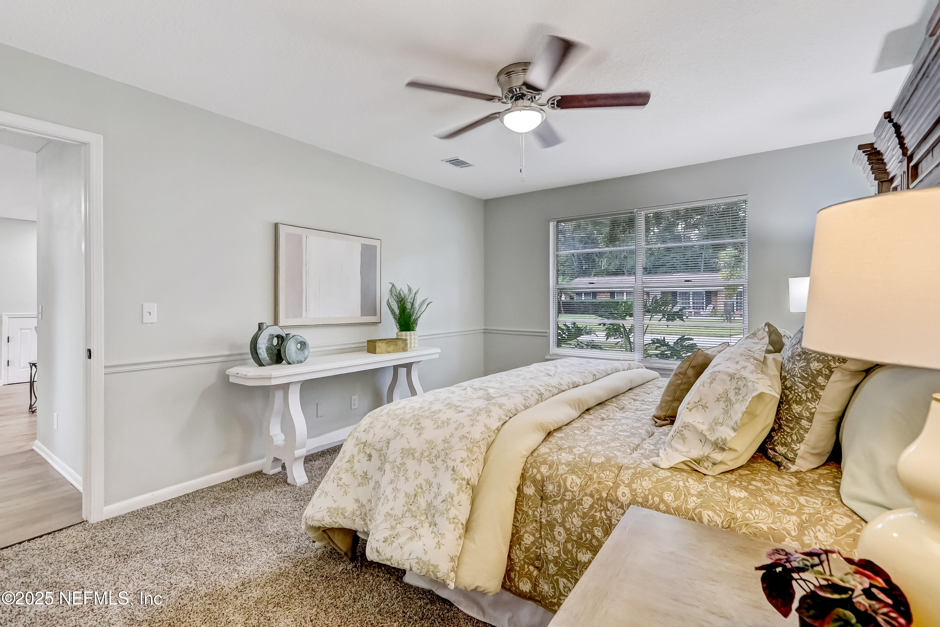 8837 Runnymeade Road Jacksonville, FL 32257 - Photo 34 of 55 a bedroom with a bed and window