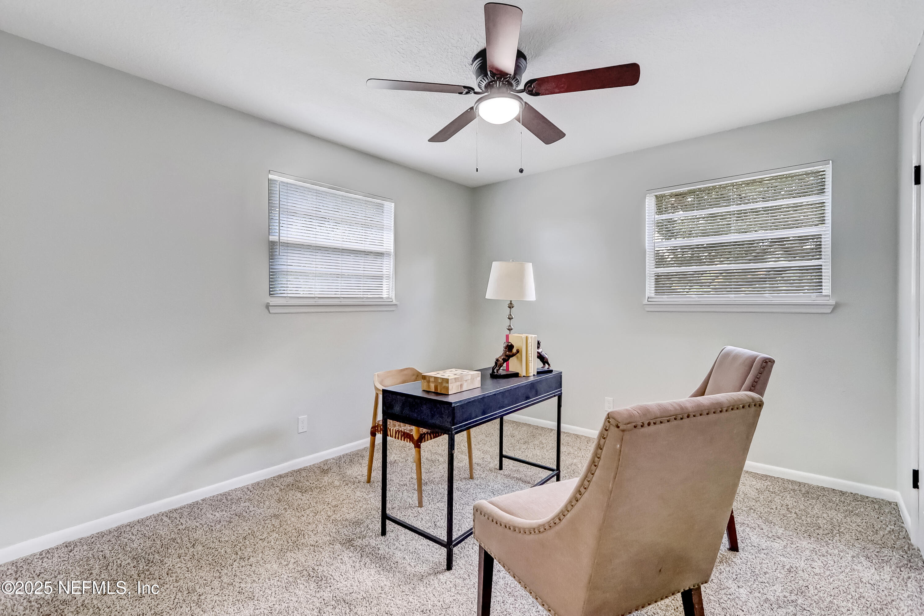 8837 Runnymeade Road Jacksonville, FL 32257 - Photo 42 of 55 a living room with furniture and a window