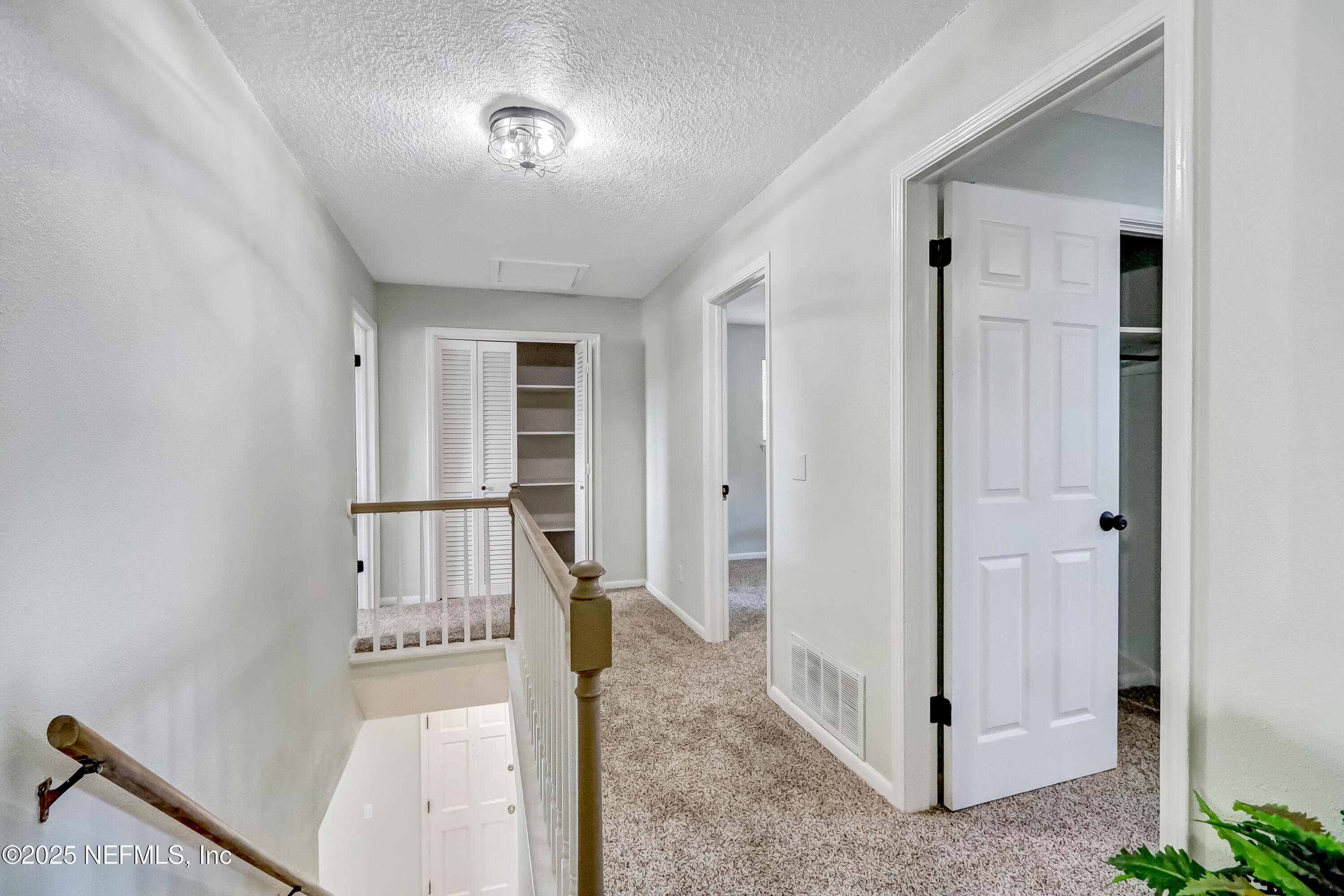 8837 Runnymeade Road Jacksonville, FL 32257 - Photo 49 of 55 a view of a hallway with closet area