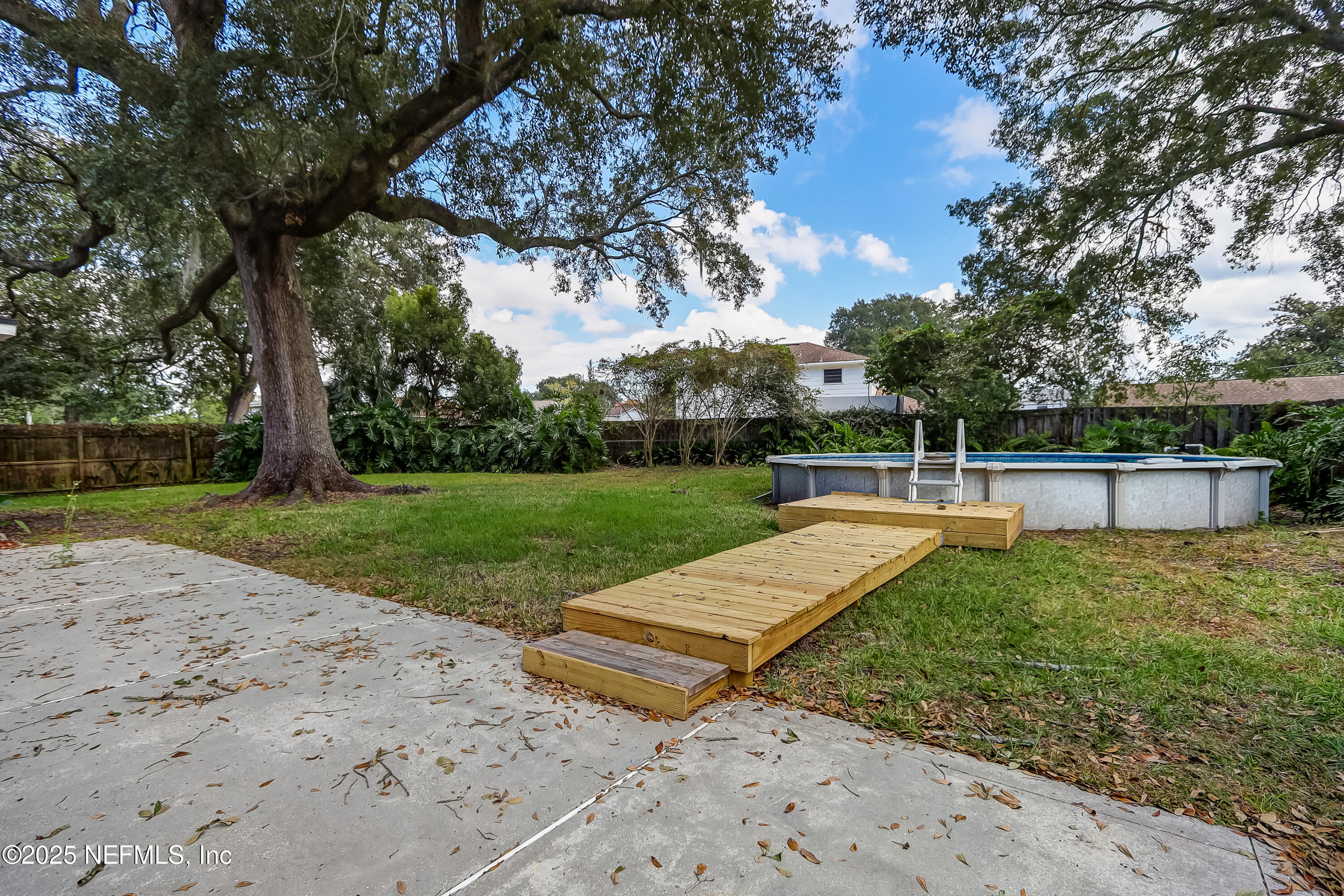 8837 Runnymeade Road Jacksonville, FL 32257 - Photo 52 of 55 a view of a backyard with a garden