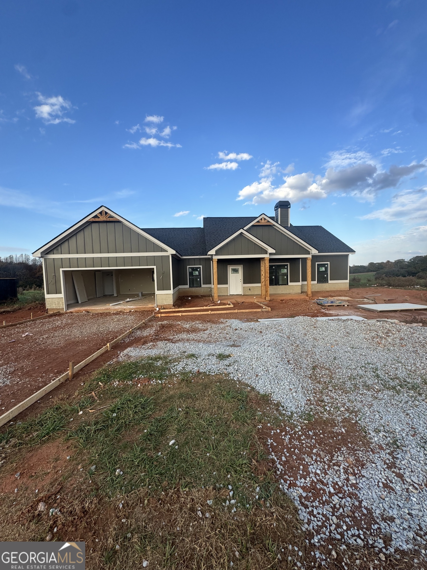 8188 Sandy Cross Road Carnesville, GA 30521 - Photo 1 of 1 a front view of a house with garden