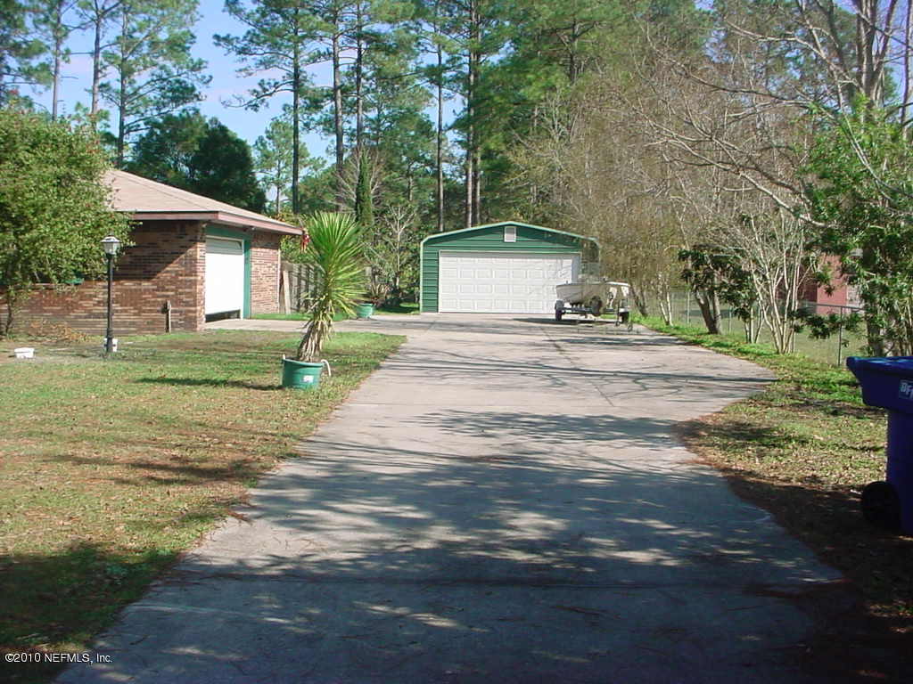 54194 Sheffield Road Callahan, FL 32011 - Photo 4 of 22 a front view of a house with a yard