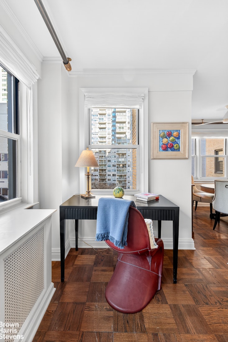 167 East 67th Street, Unit 8A Manhattan, NY 10065 - Photo 5 of 19 a living room with furniture and a window
