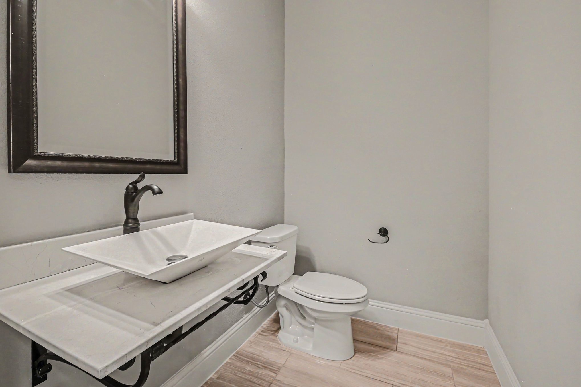 3310 Ralston Edge Lane Houston, TX 77059 - Photo 46 of 50 a bathroom with a sink toilet and mirror