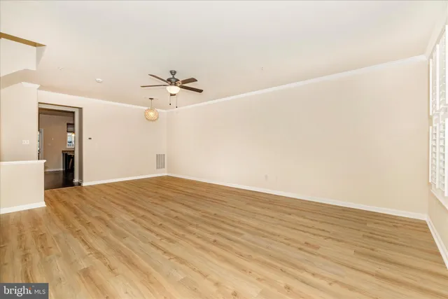 a kitchen with kitchen island granite countertop a large counter top stainless steel appliances and cabinets