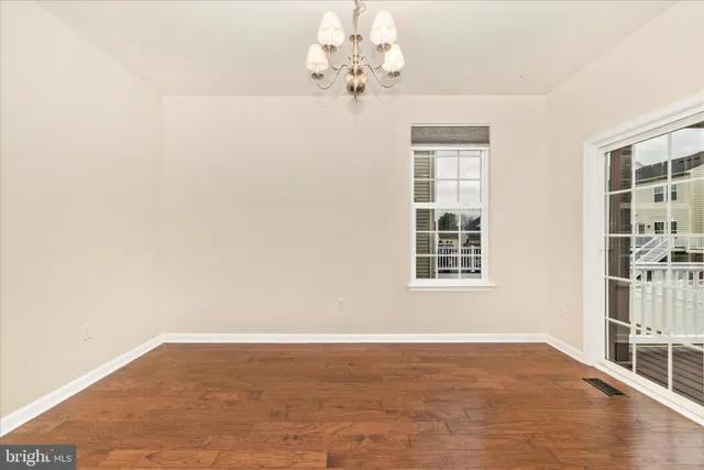 a view of a balcony with wooden floor