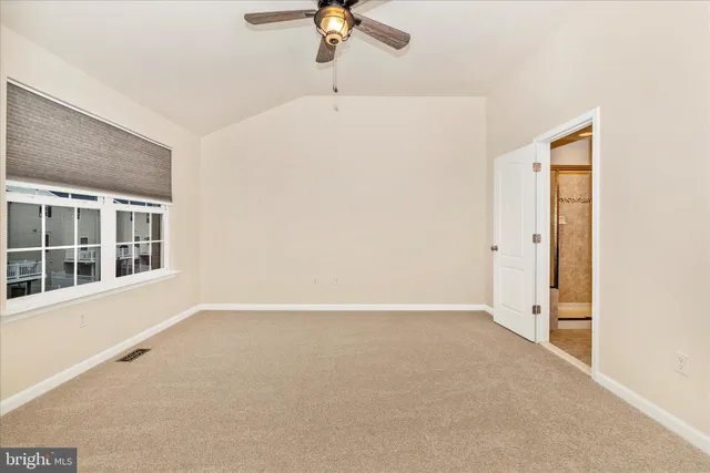 a view of a livingroom with a ceiling fan