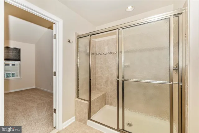 a view of an empty room with windows