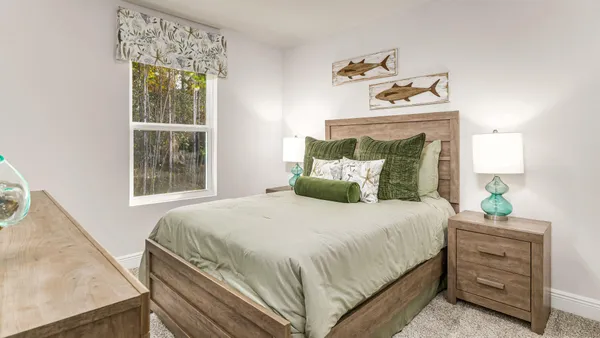 a bedroom with a bed and with window