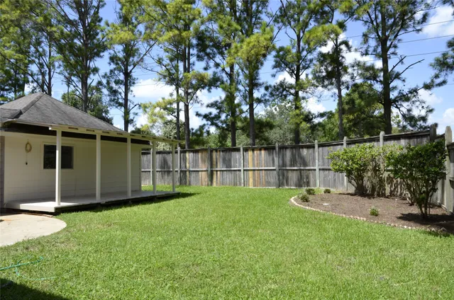 a garden with wooden fence
